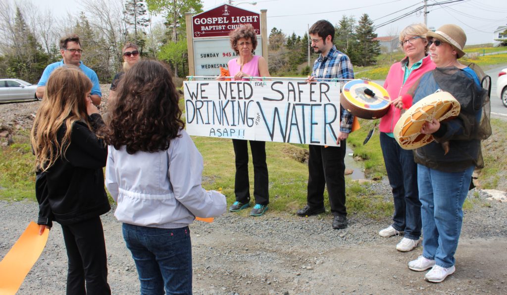 Marlene Brown and other Harrietsfield residents protest for safe drinking water in their community in 2015, across the street from the site of contamination. Photo by Rebecca Hussman.